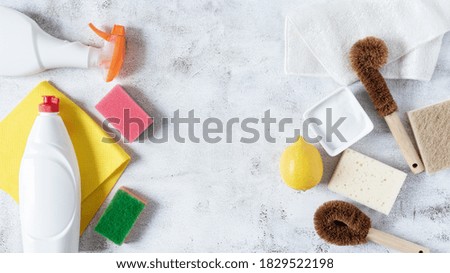 Eco friendly bamboo dish brushes and lemon with baking soda vs chemical detergent products and plastic sponges for cleaning top view. Zero waste vs plastic and chemistry concept. 