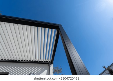 eco friendly bioclimatic aluminum pergola shade structure, awning and patio roof - Shutterstock ID 2304720461