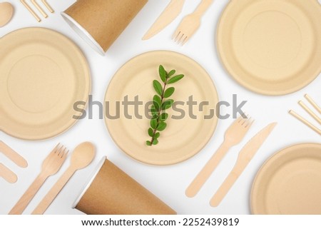 Eco friendly disposable dishware for takeout. Overhead view on a white background. Biodegradable, composable alternative to plastic.