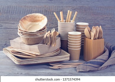 Eco friendly disposable tableware on a grey background - Shutterstock ID 1371574394