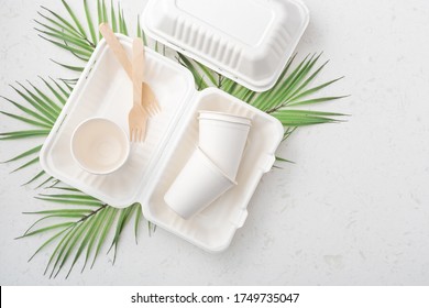 Eco Friendly Food Packaging On White Quartz Background With Copy Space, Flat Lay