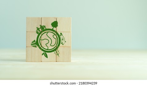 Eco Friendly, Green Company Culture Concept. Carbon Neutral And Net Zero Target. Sustainable Enviroment And Business Limit Global Warming. Build Green Community. Wooden Cubes With Eco Globe Icon.