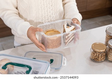 eco friendly habits hand gesture_using multiple container - Powered by Shutterstock