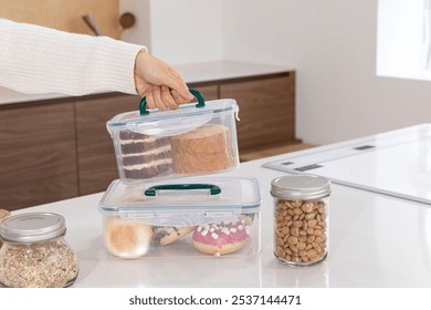 eco friendly habits hand gesture_using multiple container - Powered by Shutterstock