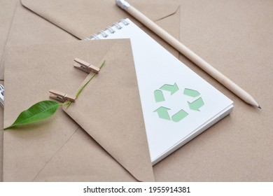 Eco Friendly Notebook With Recycle Symbol, Wooden Pencil With Green Leaf On Pin, KRAFT Envelopes. Office Eco Friendly.