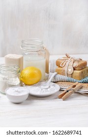 Eco Friendly Products For Home Cleaning On Table. DIY Ingredients - Lemon, Soap, Baking And Washing Soda, Vinegar. Natural Domestic Cleaning. Simple Recipes Homemade. Zero Waste Detergent