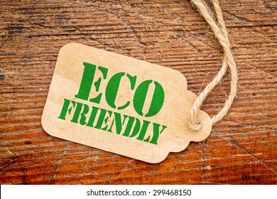 Eco Friendly  Sign A Paper Price Tag Against Rustic Red Painted Barn Wood - Shopping Concept