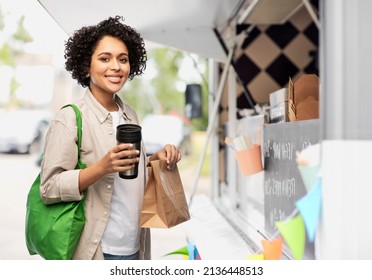 Eco Living, Zero Waste And Sustainability People Concept - Happy Smiling Woman With Thermo Cup And Shopping Bag Over Food Truck Background