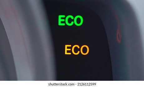 ECO Pictogram Sign At Car Dashboard. Ecological Drive Mode In Automobile Turn On And Off. Green And Yellow Active System, Gasoline And Diesel Economy. Electric Vehicle, Alternative Fuel, Hybrid Auto.