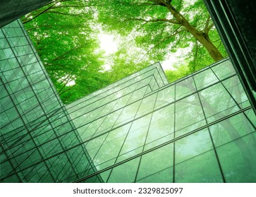 Eco-friendly building in the modern city. Sustainable glass office building with tree for reducing heat and carbon dioxide. Office building with green environment. Corporate building reduce CO2. - Shutterstock ID 2329825097