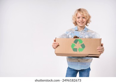 Eco-friendly caucasian blond preteen boy male child kid elementary primary middle school pupil teenager holding box full of plastic bottles for recycling isolated on white background copy space - Powered by Shutterstock