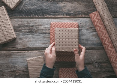  Eco-Friendly Christmas Gift Boxes In Corrugated Paper Reusable Paper On A Wooden Background. Zero Waste Environmentally Friendly Christmas Concept. High Quality Photo