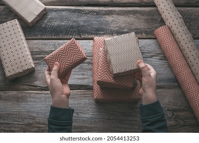  Eco-Friendly Christmas Gift Boxes In Corrugated Paper Reusable Paper On A Wooden Background. Zero Waste Environmentally Friendly Christmas Concept. High Quality Photo