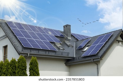 Eco-Friendly House with Solar Panels on Gable Roof - Shutterstock ID 2357851803