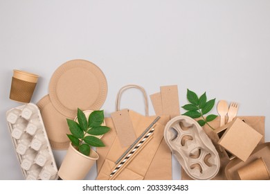 Eco-friendly Sustainable Packaging And Tableware Set - Kraft Paper Food Packaging On Gray Background With Copy Space. Street Food Paper Packaging - Cups, Plates, Straws, Containers, Paper Bags