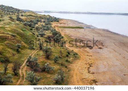 Ecological catastrophy. Top view of a bird's-eye view on drying estuary. Dry lake view from the air. Severe drought, the lake is dying without water. Dead Sea in Odessa, Ukraine, Kuyalnik