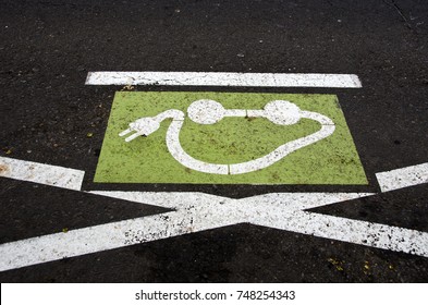 Ecological electromobile transport road sign on city asphalt