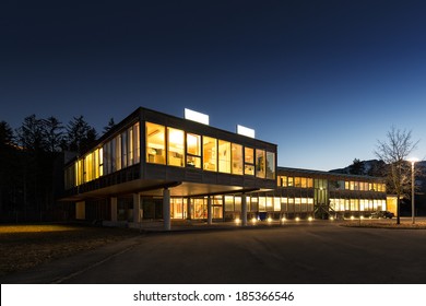 ecological energy saving wooden office building at night