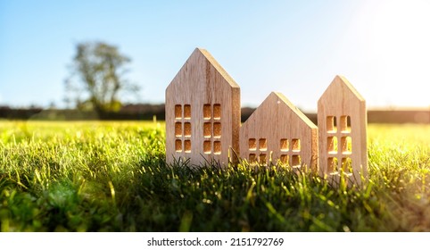 Ecological Wood  Model House In Empty Field At Sunset Concept For Construction And Real Estate