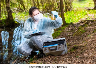 Ecologist Biologist With A Sample Of Water Samples From A Forest Lake