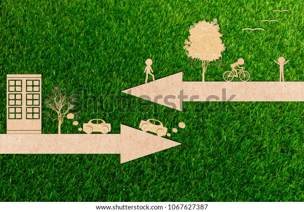 Ecology concept go green\
environment clean energy bicycles and cars are polluting of paper\
cut 