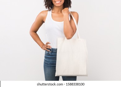 Ecology Concept. Unrecognizable African Woman With Tote Bag Over Isolated White Studio Background. Mockup, Free Space