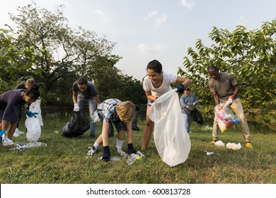 Ecology Group Of People Cleaning The Park