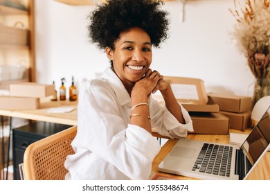 E-commerce business owner in office. Confident businesswoman smiling at camera in jewelry workshop. - Powered by Shutterstock