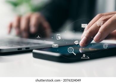 E-commerce, IOT, and digital marketing. The Internet of Things is a concept for online purchasing. Business and technology dashboard. Man using a mobile phone with icons and a Pay Per Click (PPC). - Shutterstock ID 2076324049