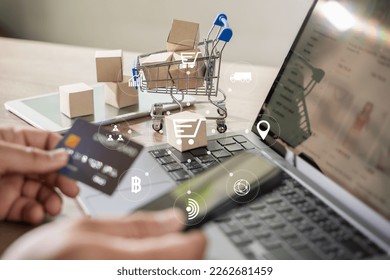 e-commerce marketing online shopping on a laptop Shopping and credit card payments for banking online, paper boxes - Shutterstock ID 2262681459