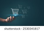 E-commerce or online shopping concept. Businessman using application on smartphone and internet network technology to be shopping online marketplace. Shopping cart hologram, Digital Marketing.