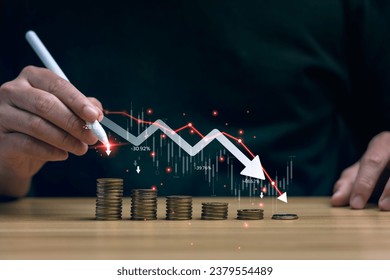 Economic collapse concept, businessman with falling financial graph chart due to global recession. Stock market crash, inflation, financial crisis, Falling income in GDP, capital reduction - Powered by Shutterstock