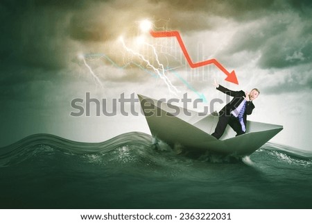 Economic crisis - Caucasian businessman afraid on a sinking ship