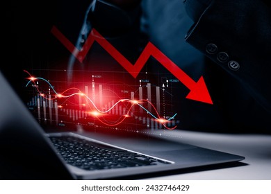 Economic crisis and global economic recession. Economic stagnation and inflation, Business investment risks. Businessman using laptop to analyze economic graph. - Powered by Shutterstock