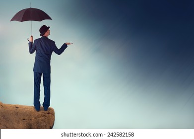 Economic Forecast Outlook Concept Businessman With Umbrella 