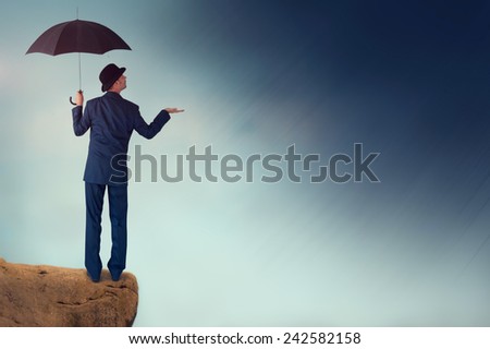 economic forecast outlook concept businessman with umbrella 