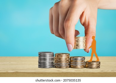 Economic Growth Stimulus. Concept With Coins, Person Rising On Coins And Helping Hand