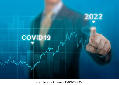 Economic Recovery In 2022. Timeline Chart Diagram Of Global Economic Recovery After Crisis Caused By Covid19 Pandemic. Businessman Pointing Graph Growth Plan On Dark Blue. Restart Economy After Crisis