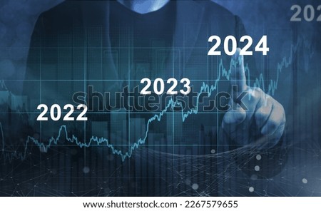 economic recovery after falling due to inflation, stagnation, recession, 2024 financial chart. Businessman pointing graph of future growth on dark blue background