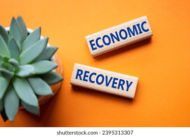 Economic recovery symbol. Concept words Economic recovery on wooden blocks. Beautiful orange background with succulent plant. Business and Economic recovery concept. Copy space. - Shutterstock ID 2395313307