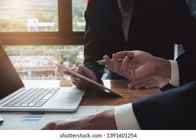 Economic research discussions, Business team analyzing income charts and graphs to plan marketing concept with using tablet and calculator  for analysis. - Shutterstock ID 1391601254