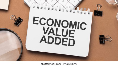 Economic Value Added On Notepad With Pen, Glasses And Calculator