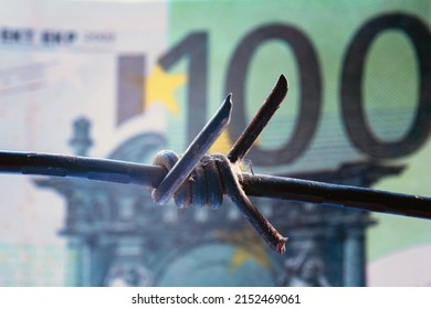 Economic Warfare, Sanctions And Embargo Busting Concept. Close Up Barbed Wire Against Money Of European Union. Horizontal Image.