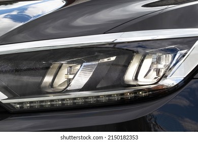 Economical and modern car headlight with LED adaptive light. Close-up