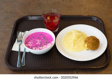 An Economical, Not Expensive Lunch With Mashed Potatoes, Cold Beetroot Soup And Turkey Cutlet On A Plastic Tray In A Diner