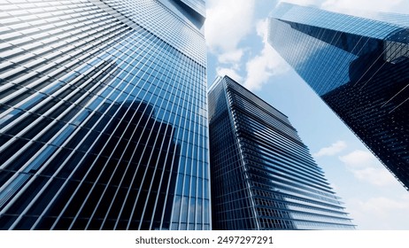 Economics, banking, business and finance concept.A fragment of a modern office building in the capital .glass buildings with cloudy blue sky background .modern office building
