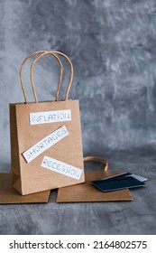 Economy After Covid Conceptual Image, Inflation Shortages And Recession Texts On Shopping Bag With Payment Cards Next To It