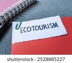 Ecotourism writting on paper background.