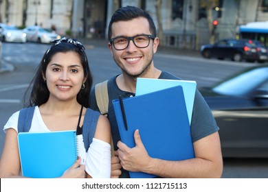 Ecstatic couple of ethnic international students abroad - Shutterstock ID 1121715113