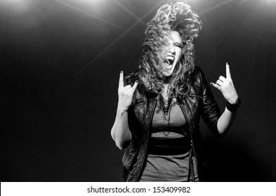 Ecstatic Woman Is Dancing To The Rock Music